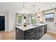 Eat-in kitchen featuring a large island with marble countertops at 4710 W 32Nd Ave, Denver, CO 80212