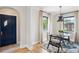 Bright eat-in kitchen with marble countertops and an adjacent dark blue front door at 4710 W 32Nd Ave, Denver, CO 80212