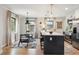 Modern kitchen featuring stainless steel appliances, a center island, and a breakfast nook at 4710 W 32Nd Ave, Denver, CO 80212