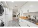 Laundry room with wooden countertop, stainless steel appliances, and access to other interior rooms at 4710 W 32Nd Ave, Denver, CO 80212