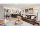 Open concept living room, dining, and kitchen featuring a leather couch at 4710 W 32Nd Ave, Denver, CO 80212