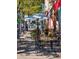 Pleasant sidewalk patio with comfortable seating, enhanced by flowers and greenery at 4710 W 32Nd Ave, Denver, CO 80212