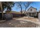 A backyard featuring an outdoor lounge area, patio, shed, and ample space for entertainment at 568 Galapago St, Denver, CO 80204