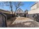 A backyard featuring an outdoor lounge area, patio, shed, and ample space at 568 Galapago St, Denver, CO 80204