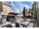 A backyard with a gazebo and a dining table perfect for entertaining guests at 568 Galapago St, Denver, CO 80204