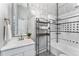 Tiled bathroom featuring a modern vanity, mirror, and shower at 568 Galapago St, Denver, CO 80204