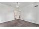 Minimal bedroom featuring carpeted floors, neutral walls, modern lighting, and natural light at 568 Galapago St, Denver, CO 80204