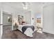 Cozy bedroom features a comfortable bed, soft carpeting, and natural light from a window at 568 Galapago St, Denver, CO 80204