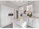 Updated kitchen featuring white cabinetry, stainless steel appliances, and sleek countertops at 568 Galapago St, Denver, CO 80204