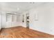 Bright living room featuring hardwood floors, built-in shelving, and neutral walls at 568 Galapago St, Denver, CO 80204