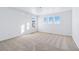 Spacious bedroom features neutral carpet, white trim, and two large windows at 23762 E 33Rd Pl, Aurora, CO 80019