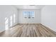 Bright, empty bedroom with beautiful light wood floors and large windows offering natural light at 23762 E 33Rd Pl, Aurora, CO 80019
