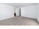 Neutral bedroom featuring carpet and white walls, leading to the en suite bathroom at 23762 E 33Rd Pl, Aurora, CO 80019