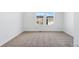 Bedroom showing neutral carpet, white walls and trim, plus two large windows at 23762 E 33Rd Pl, Aurora, CO 80019