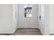 Bright entryway features wood-style flooring, white walls and trim, plus a window and door at 23762 E 33Rd Pl, Aurora, CO 80019