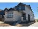 This two-story home showcases attractive siding and stone accents, and features a cozy covered front porch at 23762 E 33Rd Pl, Aurora, CO 80019