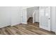 Hallway showcasing white trim and doors, with access to the carpeted stairs at 23762 E 33Rd Pl, Aurora, CO 80019