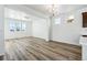 Bright living room with wood floors and white walls, offering a clean, modern aesthetic at 23762 E 33Rd Pl, Aurora, CO 80019