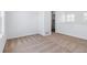 Neutral living room with white walls, a closet, and light carpet at 23762 E 33Rd Pl, Aurora, CO 80019
