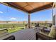 Spacious back deck with comfortable seating and stunning views of the surrounding landscape and mountains at 14805 Quince Way, Thornton, CO 80602