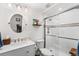 Modern bathroom with glass-enclosed shower and marble countertops, creating a spa-like experience at 14805 Quince Way, Thornton, CO 80602