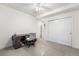 Bright bedroom with desk and a ceiling fan; closet for storage at 14805 Quince Way, Thornton, CO 80602