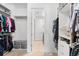 Walk in closet providing generous storage space for an organized wardrobe and personal belongings at 14805 Quince Way, Thornton, CO 80602
