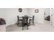 Cozy dining area with modern table and chairs, perfect for intimate meals at 14805 Quince Way, Thornton, CO 80602