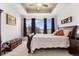 Main bedroom with trey ceiling, large windows, and plush carpet flooring, offers a serene and relaxing retreat at 14805 Quince Way, Thornton, CO 80602