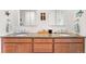 Dual sink vanity with granite countertops, offering ample space and storage in this well-appointed bathroom at 14805 Quince Way, Thornton, CO 80602