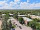 A lovely aerial view of the complex in a park-like setting with swimming pool at 5995 W Hampden Ave # 18C, Denver, CO 80227