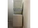 Efficient stacked washer and dryer unit, perfect for space-saving laundry needs at 5995 W Hampden Ave # 18C, Denver, CO 80227