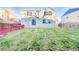 Spacious back yard with a big lawn, and mature landscaping at 10049 Granby Dr, Commerce City, CO 80022
