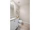 Tastefully updated powder room with granite countertop vanity, modern fixtures, and neutral color palette at 10049 Granby Dr, Commerce City, CO 80022