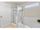 Bathroom featuring a shower with glass enclosure and a tiled bathtub at 10049 Granby Dr, Commerce City, CO 80022