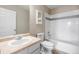 Bright bathroom with single sink vanity and combined shower and bathtub at 10049 Granby Dr, Commerce City, CO 80022