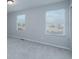 Neutral bedroom featuring carpet, natural light, and closet space at 10049 Granby Dr, Commerce City, CO 80022