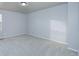 Neutral bedroom featuring carpet, natural light, and closet space at 10049 Granby Dr, Commerce City, CO 80022