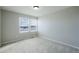 Neutral bedroom featuring carpet, natural light, and closet space at 10049 Granby Dr, Commerce City, CO 80022