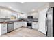 Bright kitchen with stainless steel appliances and white cabinets at 10049 Granby Dr, Commerce City, CO 80022