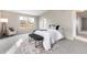 Bright main bedroom with comfortable seating area, providing natural light and views at 10049 Granby Dr, Commerce City, CO 80022