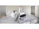 Bright main bedroom with carpet, neutral walls, and a walk-in closet for ample storage space at 10049 Granby Dr, Commerce City, CO 80022