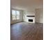 Spacious living room features a modern fireplace, mantle and large windows that provide ample natural light at 14295 Currant St, Broomfield, CO 80020