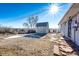Backyard view, showing shed, gravel, and flagstone path at 3446 S Clay St, Englewood, CO 80110