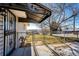 Small backyard with a gate and a partial view of the neighborhood at 3446 S Clay St, Englewood, CO 80110