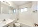 Clean bathroom with a shower/tub combo and updated vanity at 3446 S Clay St, Englewood, CO 80110