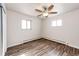 Well-lit bedroom, offering wood-look floors and ceiling fan at 3446 S Clay St, Englewood, CO 80110