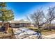 Ranch style home with a spacious driveway and mature trees at 3446 S Clay St, Englewood, CO 80110