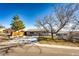 House exterior showcasing a well-maintained lawn and landscaping at 3446 S Clay St, Englewood, CO 80110
