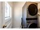 Bright laundry room with LG washer and dryer, and exterior access at 3446 S Clay St, Englewood, CO 80110